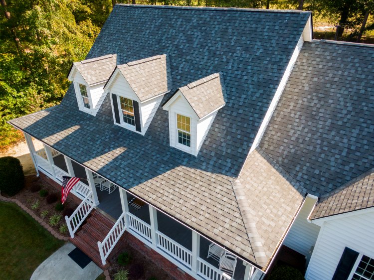 Aerial view of residential home with new asphalt shingles